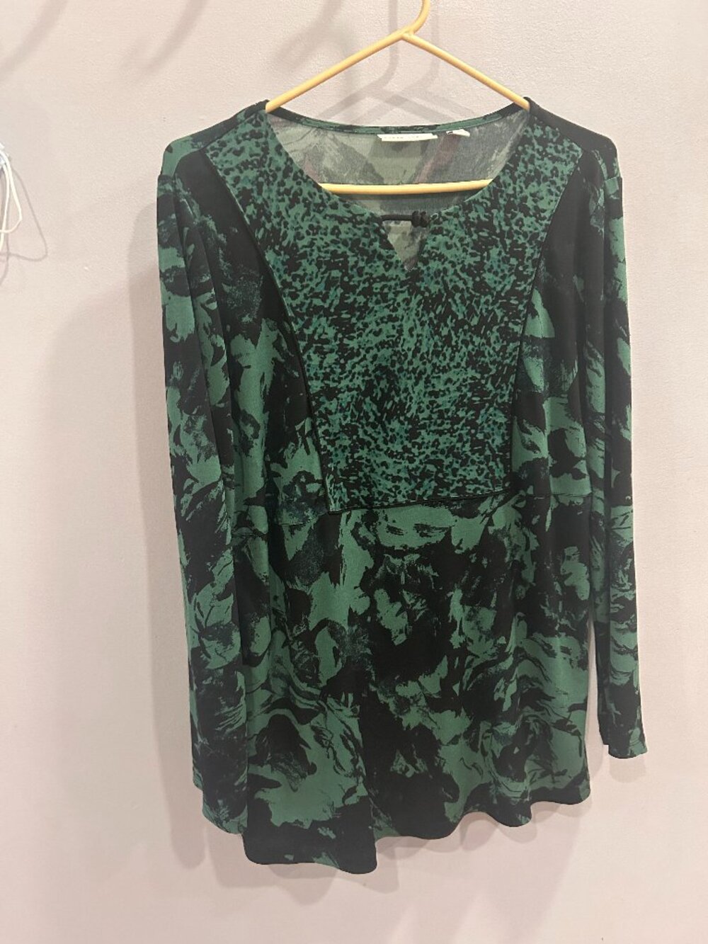 Green and black, flowy, comfortable blouse.